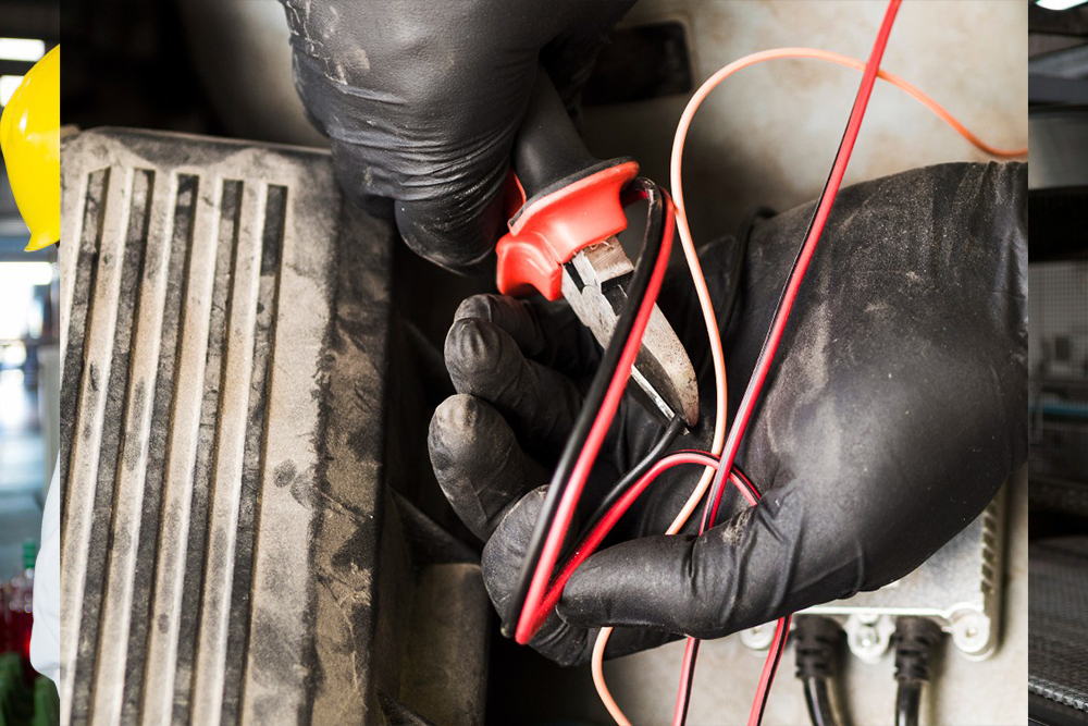 man-using-cutters-cut-wires